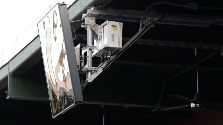 A radar device is seen on the roof behind home plate at PeoplesBank Park during the Atlantic League All-Star minor league baseball game July 10, 2019, in York, Pa. The robot strike zone will be getting slightly bigger at Triple-A starting Tuesday, Sept. 5 2023, in an attempt to make it better reflect individual batters rather than averages, and the pitch clock will be altered, too. (Julio Cortez/AP)