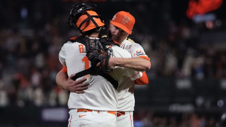 San Francisco Giants pitcher Alex Cobb, right, hugs catcher Patrick Bailey after the team's 6-1 victory over the Cincinnati Reds in a baseball game Tuesday, Aug. 29, 2023, in San Francisco. (Godofredo A. Vásquez/AP)