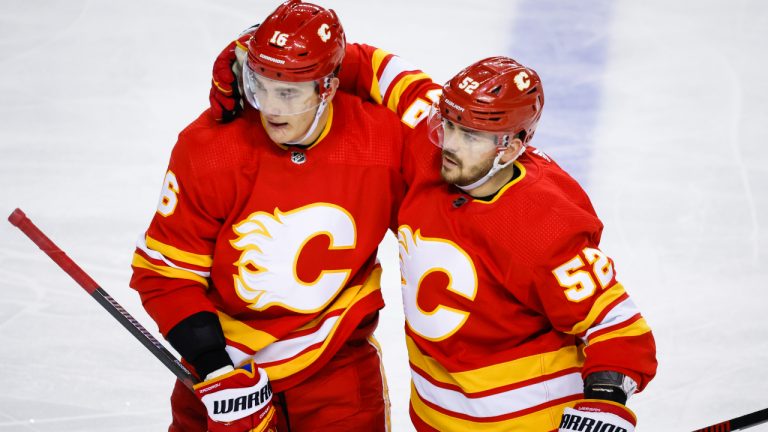 Calgary Flames defenceman Nikita Zadorov, left, celebrates his goal with teammate defenceman MacKenzie Weegar during third period NHL hockey action against the San Jose Sharks in Calgary, Wednesday, April 12, 2023. (Jeff McIntosh/CP)