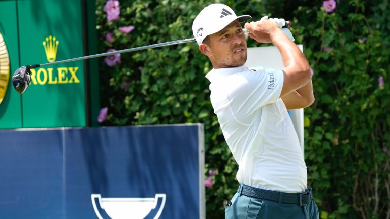 Xander Schauffele watches his tee shot on the first hole during the final round of the BMW Championship golf tournament, Sunday, Aug. 20, 2023, in Olympia Fields, Ill. (Charles Rex Arbogast/AP)
