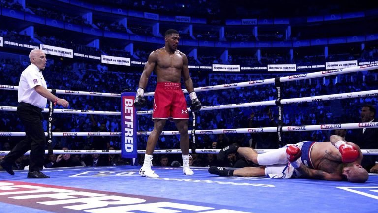 Referee Victor Loughlin, left, reacts after Anthony Joshua knocked out Robert Helenius in a heavyweight boxing bout. (Nick Potts/AP)
