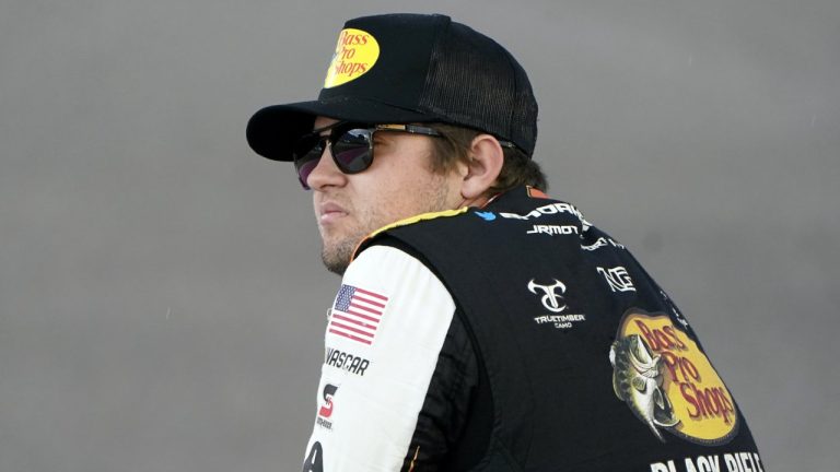 FILE - Noah Gragson looks out onto the track before a NASCAR Xfinity Series auto racing practice session at Homestead-Miami Speedway, Friday, Oct. 21, 2022, in Homestead, Fla. Gragson has been suspended indefinitely by NASCAR and Legacy Motor Club due to undisclosed activity on social media. (Lynne Sladky/AP)