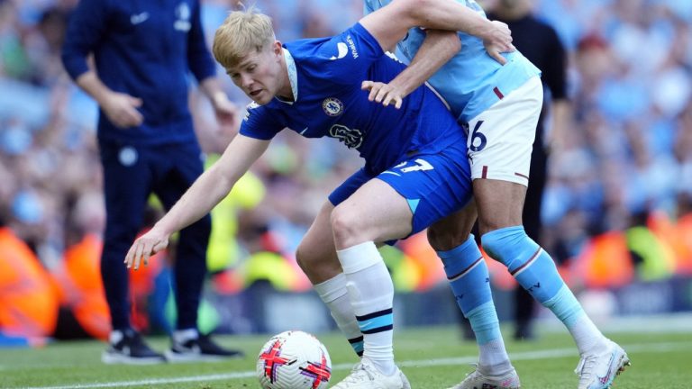 Chelsea's Lewis Hall, left, is challenged by Manchester City's Riyad Mahrez during the English Premier League soccer match between Manchester City and Chelsea at the Etihad Stadium in Manchester, England, May 21, 2023.  (Jon Super/AP)