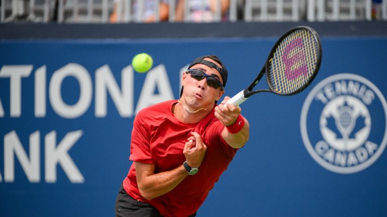 Canada's Justin Boulais returns the ball from France’s Corentin Moutet during a qualifying round at the National Bank Open in Toronto on Saturday, August 5, 2023. (Christopher Katsarov/THE CANADIAN PRESS)