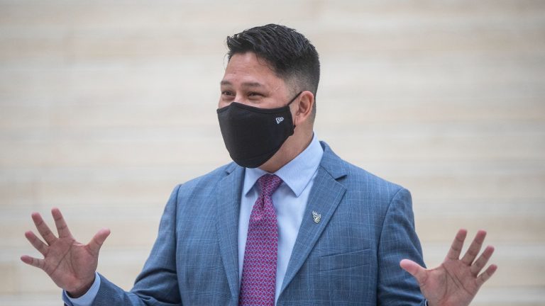 Victor Cui, President and CEO of the Edmonton Elks, speaks to media after presenting Mayor Amarjeet Sohi with a jersey, in Edmonton, Alta., on Tuesday January 25, 2022. (Jason Franson/THE CANADIAN PRESS)