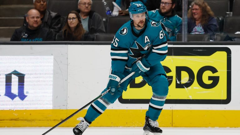San Jose Sharks defenseman Erik Karlsson looks to pass the puck during the first period of the team's NHL hockey game against Minnesota Wild in San Jose, Calif., Saturday, March 11, 2023. (Josie Lepe/AP)