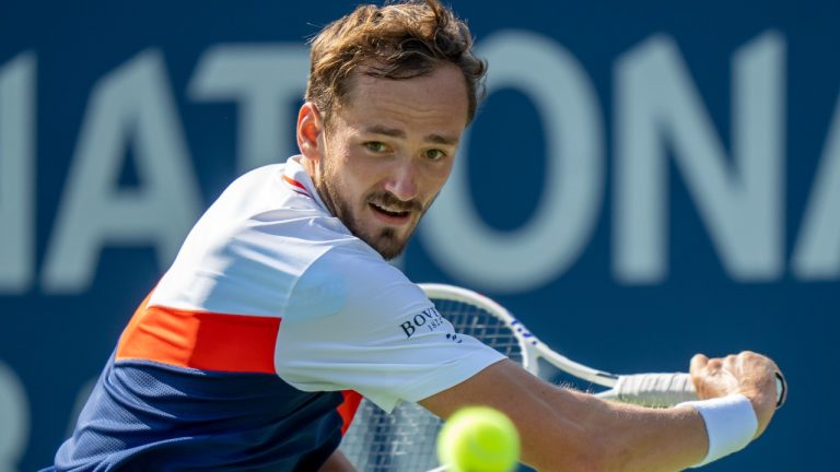 Daniil Medvedev returns a shot on his way to defeating Lorenzo Musetti of Italy in tennis action at the National Bank Open in Toronto, Thursday, Aug. 10, 2023. (Frank Gunn/CP)