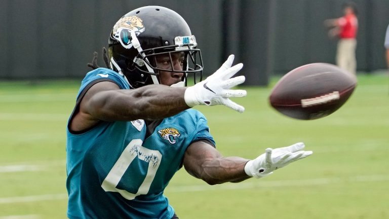 Jacksonville Jaguars wide receiver Calvin Ridley (0) makes a catch during a passing drill in practice at the NFL football team's training camp, Monday, July 31, 2023, in Jacksonville, Fla. (John Raoux/AP)
