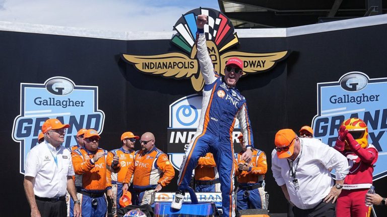 Scott Dixon, of New Zealand, celebrates after winning the IndyCar Indianapolis GP auto race at Indianapolis Motor Speedway. (Darron Cummings/AP)
