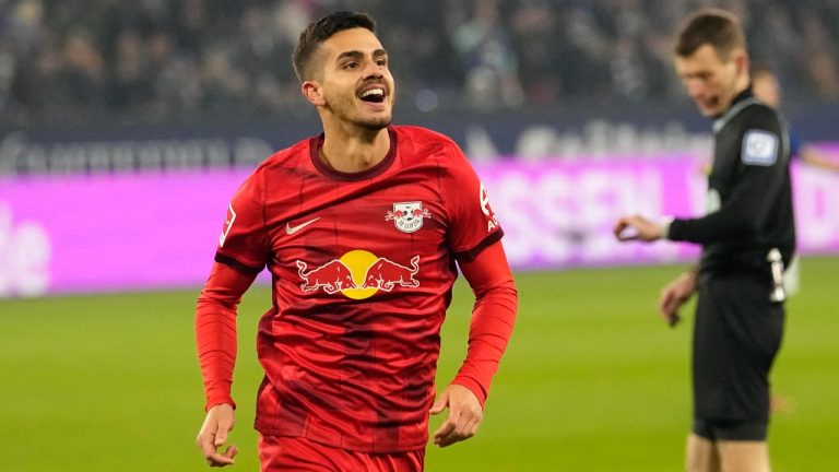 Leipzig's Andre Silva celebrates after he scores the opening goal during the German Bundesliga soccer match between FC Schalke 04 and RB Leipzig at the Arena in Gelsenkirchen, Germany, Tuesday, Jan. 24, 2023. (Martin Meissner/AP)