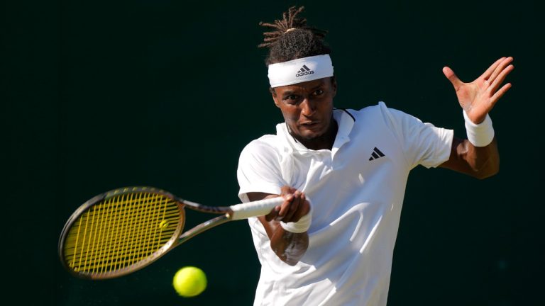 Sweden's Mikael Ymer plays a return to Colombia's Daniel Elahi Galan during the men's singles match on day five of the Wimbledon tennis championships in London, Friday, July 7, 2023. (Alastair Grant/AP)