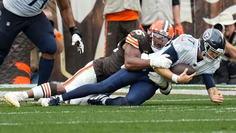 Cleveland Browns defensive end Myles Garrett sacks Tennessee Titans quarterback Ryan Tannehill during the second half of an NFL football game Sunday, Sept. 24, 2023, in Cleveland. (Sue Ogrocki/AP Photo)