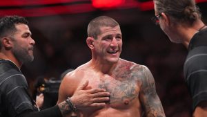 Marc-Andre Barriault, centre, celebrates after defeating Eryk Anders during a UFC 289 middleweight bout, in Vancouver, on Saturday, June 10, 2023. (CP)
