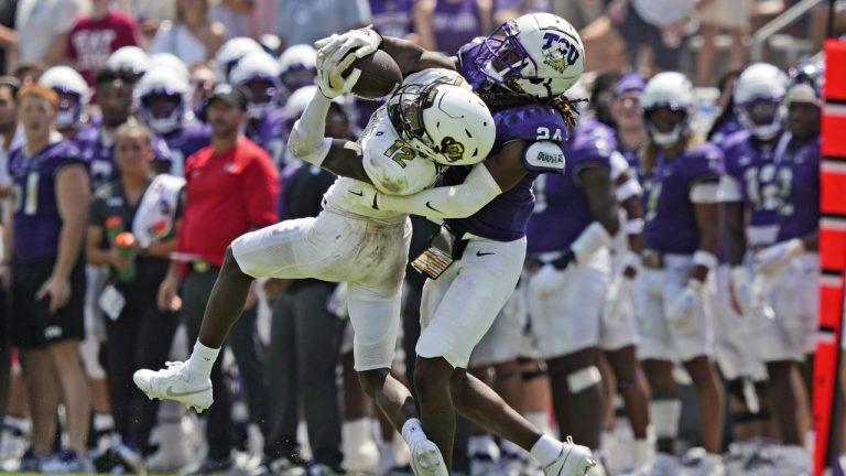 Colorado cornerback Travis Hunter (12) catches a pass for a first down against TCU cornerback Avery Helm (24) during the second half of an NCAA college football game Saturday, Sept. 2, 2023, in Fort Worth, Texas. (LM Otero/AP)