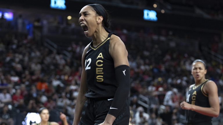 Las Vegas Aces forward A'ja Wilson (22) celebrates after blocking a Chicago Sky shot during the second half of Game 1 of a WNBA basketball playoff series Wednesday, Sept. 13, 2023, in Las Vegas. (Ellen Schmidt/Las Vegas Review-Journal via AP)