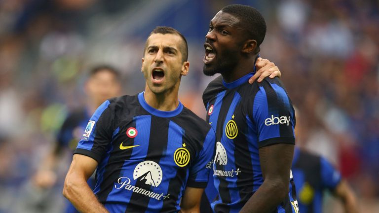 Inter Milan's Marcus Thuram, right, celebrates with teammate Henrikh Mkhitaryan after scoring their side's second goal during a Serie A soccer match between Inter Milan and AC Milan at the San Siro stadium in Milan, Italy, Saturday, Sept.16, 2023. (Spada//LaPresse via AP) 