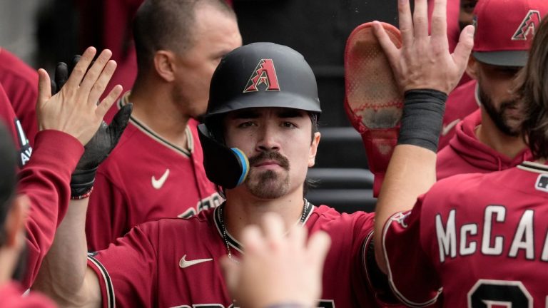 Arizona Diamondbacks' Corbin Carroll celebrates with teammates after scoring on a one-run single by Tommy Pham during the third inning of a baseball game against the Chicago White Sox in Chicago, Wednesday, Sept. 27, 2023. (Nam Y. Huh/AP Photo)