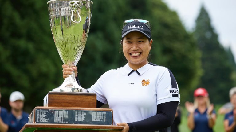 Chanettee Wannasaen, of Thailand, holds the trophy after winning the LPGA Portland Classic golf tournament in Portland, Ore., Sunday, Sept. 3, 2023. (Craig Mitchelldyer/AP)