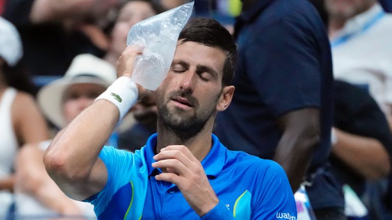 Novak Djokovic, of Serbia, cools off during a break as he plays Borna Gojo, of Croatia, during the fourth round of the U.S. Open tennis championships, Sunday, Sept. 3, 2023, in New York. (John Minchillo/AP)