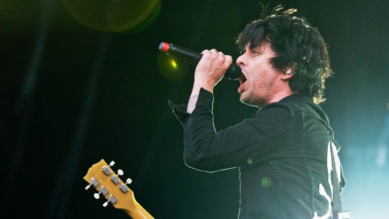 In this picture made available Sunday June 9, 2013, Billie Joe Armstrong, of US band 'Green Day' performs at the 'Rock im Park, festival in Nuremberg, Germany. (AP Photo/dpa, Daniel Karmann)