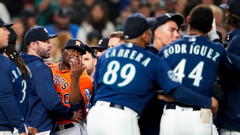 Houston Astros relief pitcher Hector Neris (50) gestures to Seattle Mariners' Julio Rodríguez (44) after striking Rodríguez out to end the sixth inning of a baseball game Wednesday, Sept. 27, 2023, in Seattle. (Lindsey Wasson/AP)