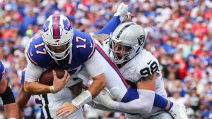 Las Vegas Raiders' Maxx Crosby (98) and Marcus Epps (1) tackle Buffalo Bills quarterback Josh Allen (17) during the first half of an NFL football game, Sunday, Sept. 17, 2023, in Orchard Park, N.Y. (Jeffrey T. Barnes/AP)