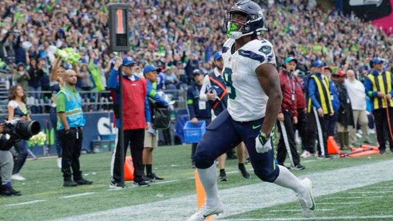Seattle Seahawks running back Kenneth Walker III celebrates after scoring during the second half of an NFL football game against the Carolina Panthers Sunday, Sept. 24, 2023, in Seattle. (John Froschauer/AP)