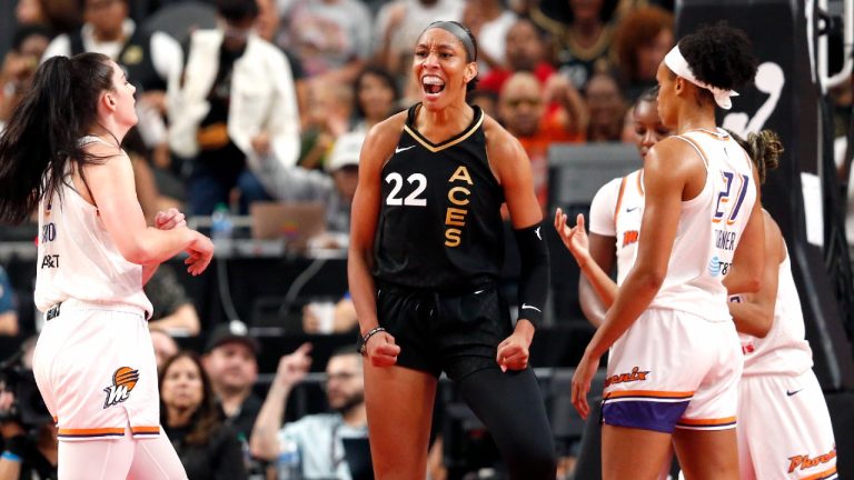 Las Vegas Aces forward A'ja Wilson (22) celebrates after scoring a basket against the Phoenix Mercury during the first half of a WNBA basketball game Sunday, Sept. 10, 2023, in Las Vegas. (Steve Marcus/Las Vegas Sun via AP)