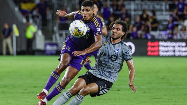 Orlando City midfielder Wilder Cartagena, left, and CF Montreal midfielder Ahmed Hamdi vie for the ball during the first half of an MLS soccer match Saturday, Sept. 30, 2023, in Orlando, Fla. (Kevin Kolczynski/AP)