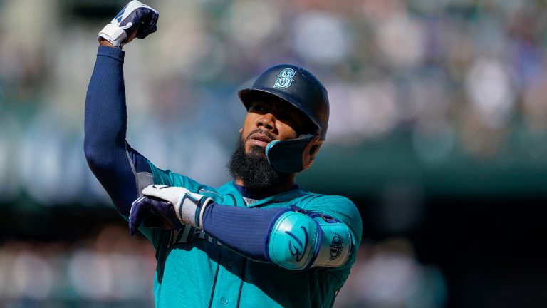 Seattle Mariners' Teoscar Hernandez gestures to the dugout after hitting an RBI single against the Los Angeles Angels during the fifth inning of a baseball game Wednesday, Sept. 13, 2023, in Seattle. (Lindsey Wasson/AP)