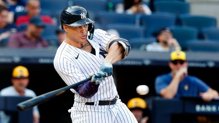 Yankees' Giancarlo Stanton (27) hits a home run against the Milwaukee Brewers during the 12th inning of a baseball game, Sunday, Sept.10, 2023, in New York. (Noah K. Murray/AP)