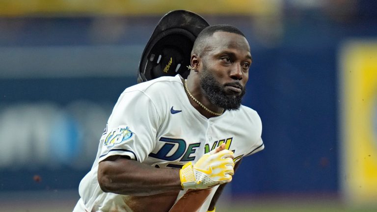 Tampa Bay Rays' Randy Arozarena scores on an RBI single by Harold Ramirez off Toronto Blue Jays starting pitcher Chris Bassitt during the first inning of a baseball game Friday, Sept. 22, 2023, in St. Petersburg, Fla. (Chris O'Meara/AP Photo)