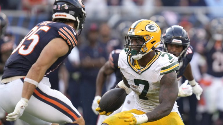 Green Bay Packers linebacker Quay Walker heads to the end zone for a touchdown after he intercepted a pass by Chicago Bears quarterback Justin Fields during the second half of an NFL football game Sunday, Sept. 10, 2023, in Chicago. (Erin Hooley/AP)