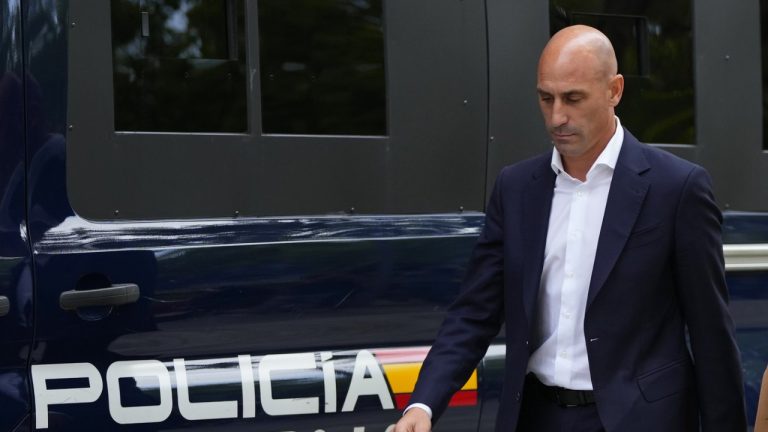 The former president of Spain's soccer federation Luis Rubiales, left, passes a police van as he leaves after testifying at the National Court in Madrid, Spain, Friday, Sept. 15, 2023. (Manu Fernandez/AP)