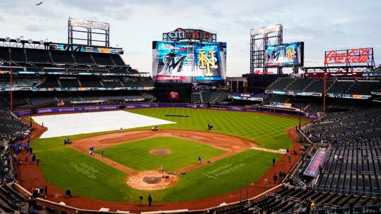 The grounds crew works on the field before a baseball game between the Miami Marlins and the New York Mets, Tuesday, Sept. 26, 2023, at Citi Field in New York. (Frank Franklin II/AP)