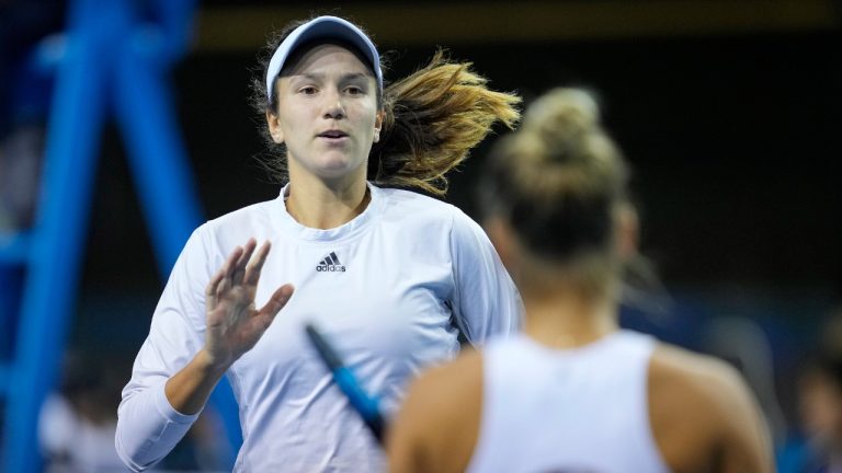Anna Danilina, left, and Yulia Putintseva of Kazakhstan react during a match against Aliona Bolsova and Paula Badosa of Spain, on the second day of the Billie Jean King Cup finals at Emirates Arena in Glasgow, Scotland, Wednesday, Nov. 9, 2022. (Kin Cheung/AP)