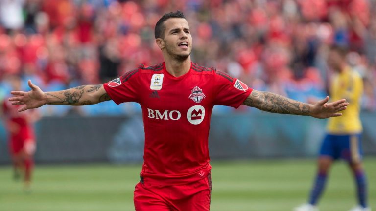 In this Sept. 19, 2015, file photo, Toronto FC's Sebastian Giovinco celebrates after scoring his team's second goal against the Colorado Rapids during the first half of the MLS soccer game in Toronto. (Chris Young/CP)