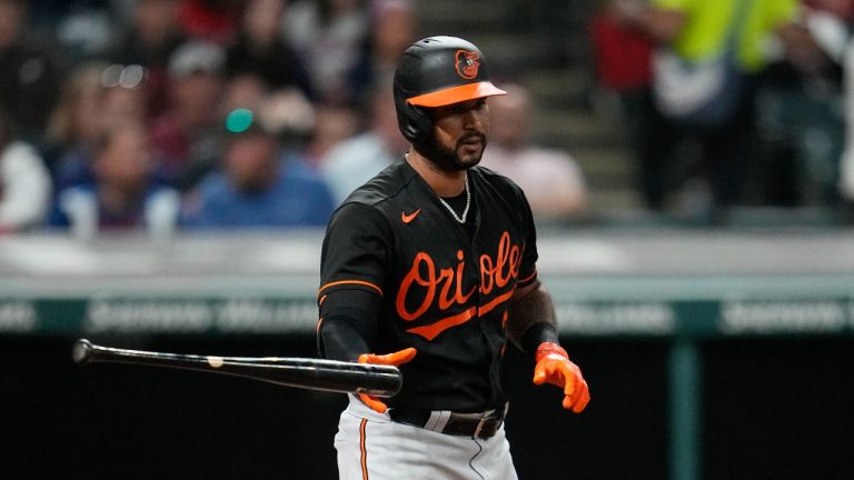 Baltimore Orioles' Aaron Hicks tosses his bat after he walked during the sixth inning of the team's baseball game against the Baltimore Orioles, Friday, Sept. 22, 2023, in Cleveland. (Sue Ogrocki/AP Photo)
