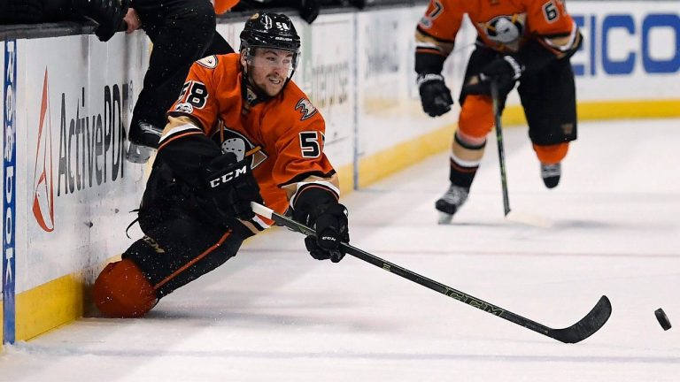 Anaheim Ducks left wing Nicolas Kerdiles passes the puck as he falls during the second period of the team's NHL hockey game against the Boston Bruins, Wednesday, Feb. 22, 2017, in Anaheim, Calif. (Mark J. Terrill/AP)
