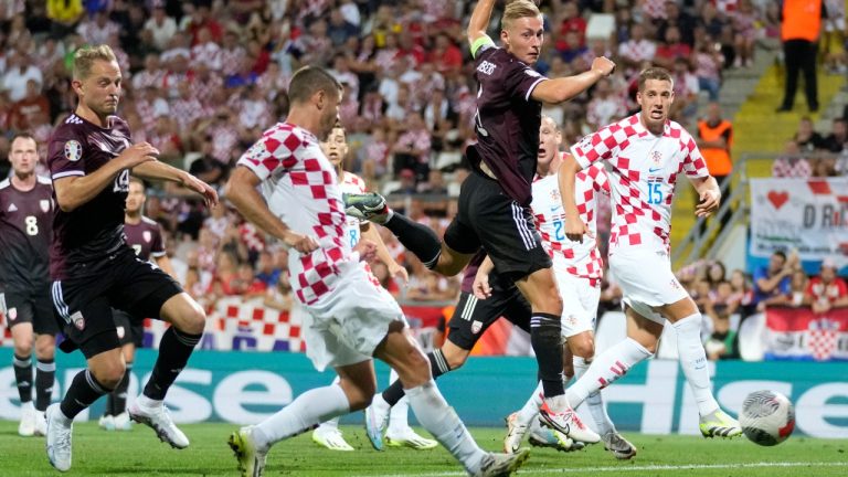 Croatia's Andrej Kramaric, second left, scores his side's fourth goal during the Euro 2024 group D qualifying soccer match between Croatia and Latvia at Rujevica stadium in Rijeka, Croatia, Friday, Sept. 8, 2023. (Darko Bandic/AP)