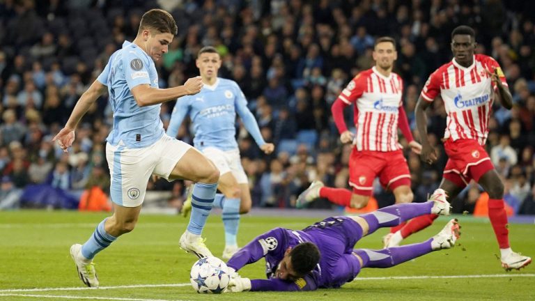 Manchester City's Julian Alvarez gets past Red Star's goalkeeper Omri Glazer to score his side's first goal during the Champions League group G soccer match between Manchester City and Red Star Belgrade in Manchester. (Dave Thompson/AP)

