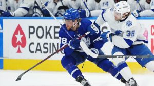 Toronto Maple Leafs forward William Nylander (88) and Tampa Bay Lightning forward Brandon Hagel (38) battle for the puck during first period NHL Stanley Cup playoff hockey action in Toronto on Thursday, April 27, 2023. (Nathan Denette/CP)