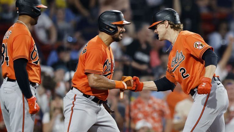 Baltimore Orioles' Gunnar Henderson (2) celebrates his three-run home run that scored Anthony Santander, center, and Aaron Hicks, left, during the seventh inning of a baseball game against the Boston Red Sox. (Michael Dwyer/AP)