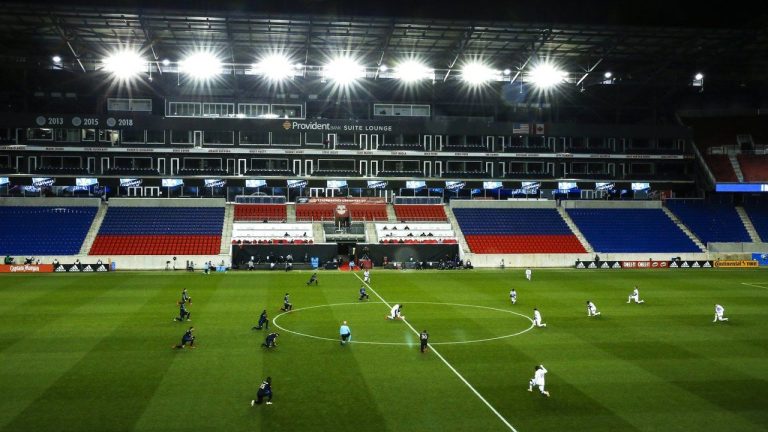 Orlando City and Montreal Impact players take a knee before their MLS match, Sunday, Nov. 1, 2020, at Red BullArena in Harrison, NJ. Toronto FC's game with New York City FC has been put back a day to Sunday due to to a water main break to the pipeline that services Red Bull Arena. (Eduardo Munoz Alvarez/CP)