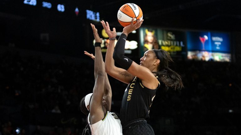 Las Vegas Aces forward A'ja Wilson (22) celebrates after blocking a Chicago Sky shot during the second half of Game 1 of a WNBA basketball playoff series Wednesday, Sept. 13, 2023, in Las Vegas. (Ellen Schmidt/Las Vegas Review-Journal via AP)