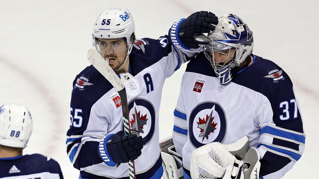 Jets, Connor Hellebuyck stuff Wild in fight-filled shutout