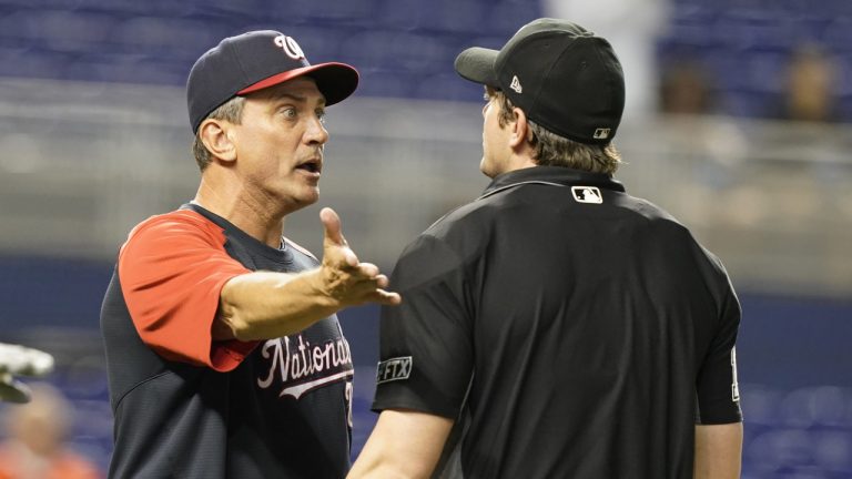 Washington Nationals bench coach Tim Bogar, left, argues a call with home plate umpire Adam Beck during the 10th inning of a baseball game against the Miami Marlins, Monday, Sept. 20, 2021, in Miami. (Marta Lavandier/AP)