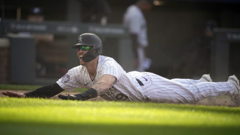 Colorado Rockies' Brenton Doyle reacts after scoring the winning run on a wild pitch by Minnesota Twins relief pitcher Jordan Luplow in the 11th inning of a baseball game Sunday, Oct. 1, 2023, in Denver. (David Zalubowski/AP)