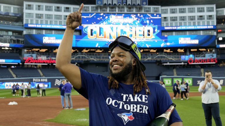 Toronto Blue Jays' Vladimir Guerrero Jr. celebrates on the field after the team clinched a berth in the American League wildcard series, following an AL MLB baseball game against the Tampa Bay Rays, in Toronto, Sunday, Oct. 1, 2023. (Frank Gunn/CP)