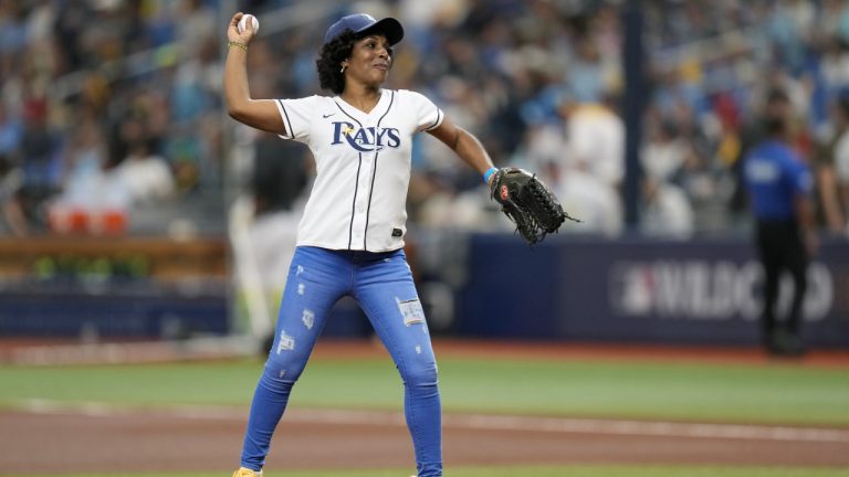 Sandra Gonzalez, mother of Tampa Bay Rays left fielder Randy Arozarena throws out the first pitch before a AL wild-card baseball playoff series game between the Tampa Bay Rays and Texas Rangers, Tuesday, Oct. 3, 2023, in St. Petersburg, Fla. (John Raoux/AP)